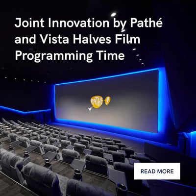 Modern cinema auditorium with large screen with Pathe logo and seating rows.